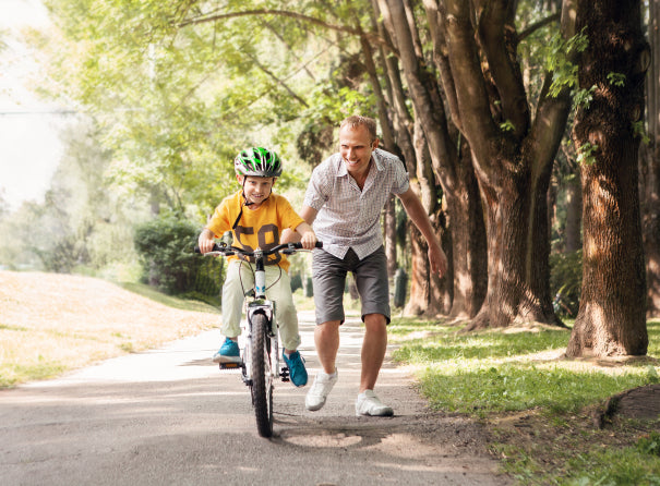 9 Foolproof (& Tear-Free) Ways to Get Your Kids Riding a Bike